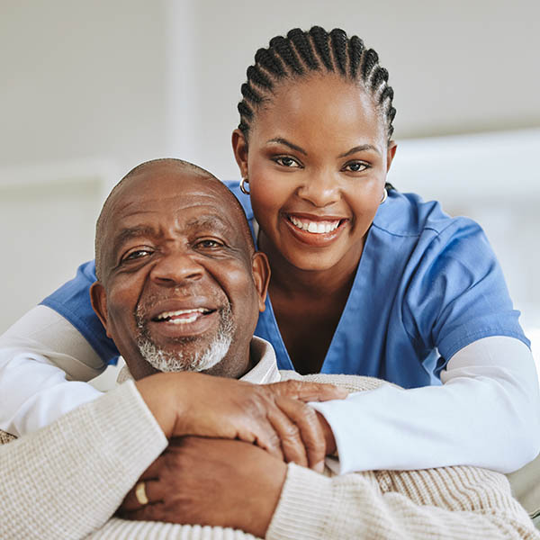 She is my sunshine. Shot of a nurse speaking to her male patient